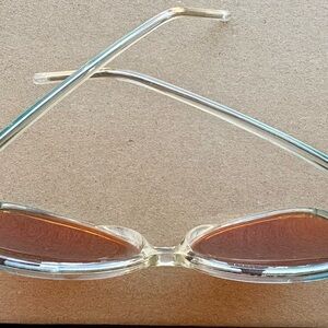 Vintage turquoise frame and rose colored sunglasses.